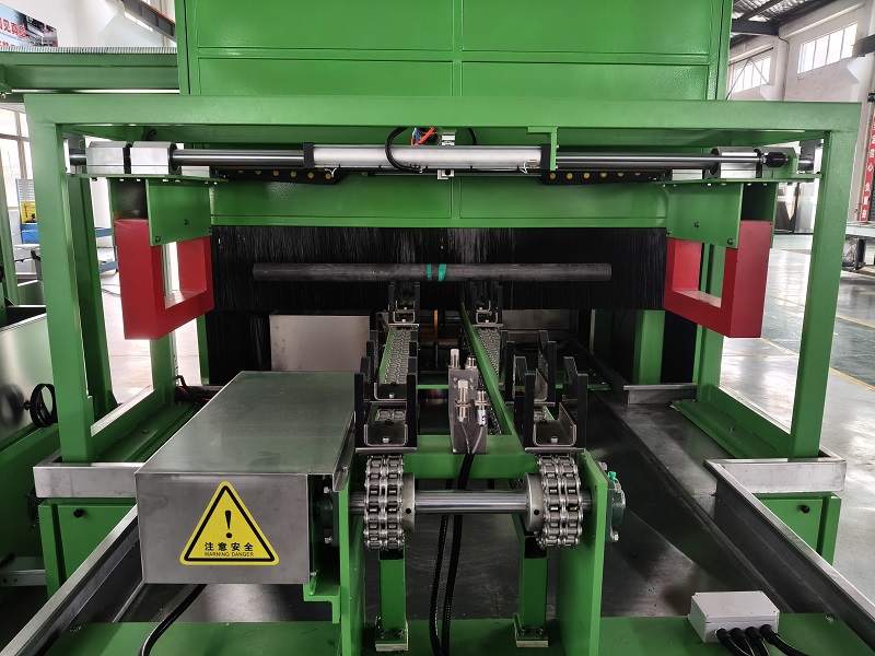 Coil magnetization system for shaft components in fluorescent magnetic particle inspection line