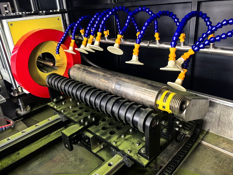 Roller support conveyor system for automatic valve rod magnetic particle inspection machine
