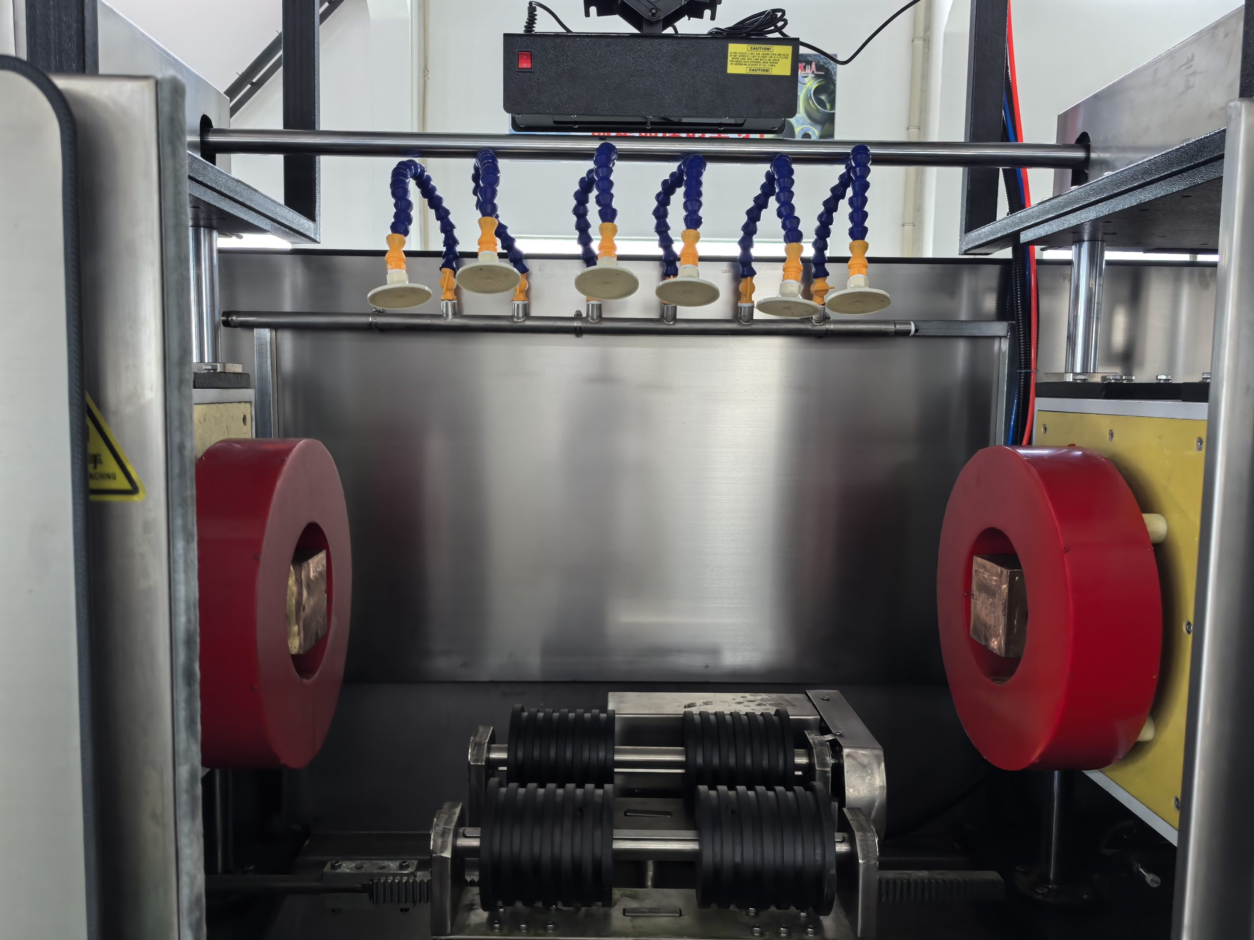 Pipe coupling inspection station using fluorescent magnetic particle testing technology